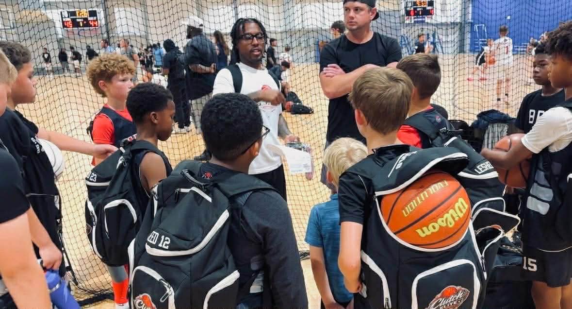 Coach giving instructions to Clutch Elite players before a game
