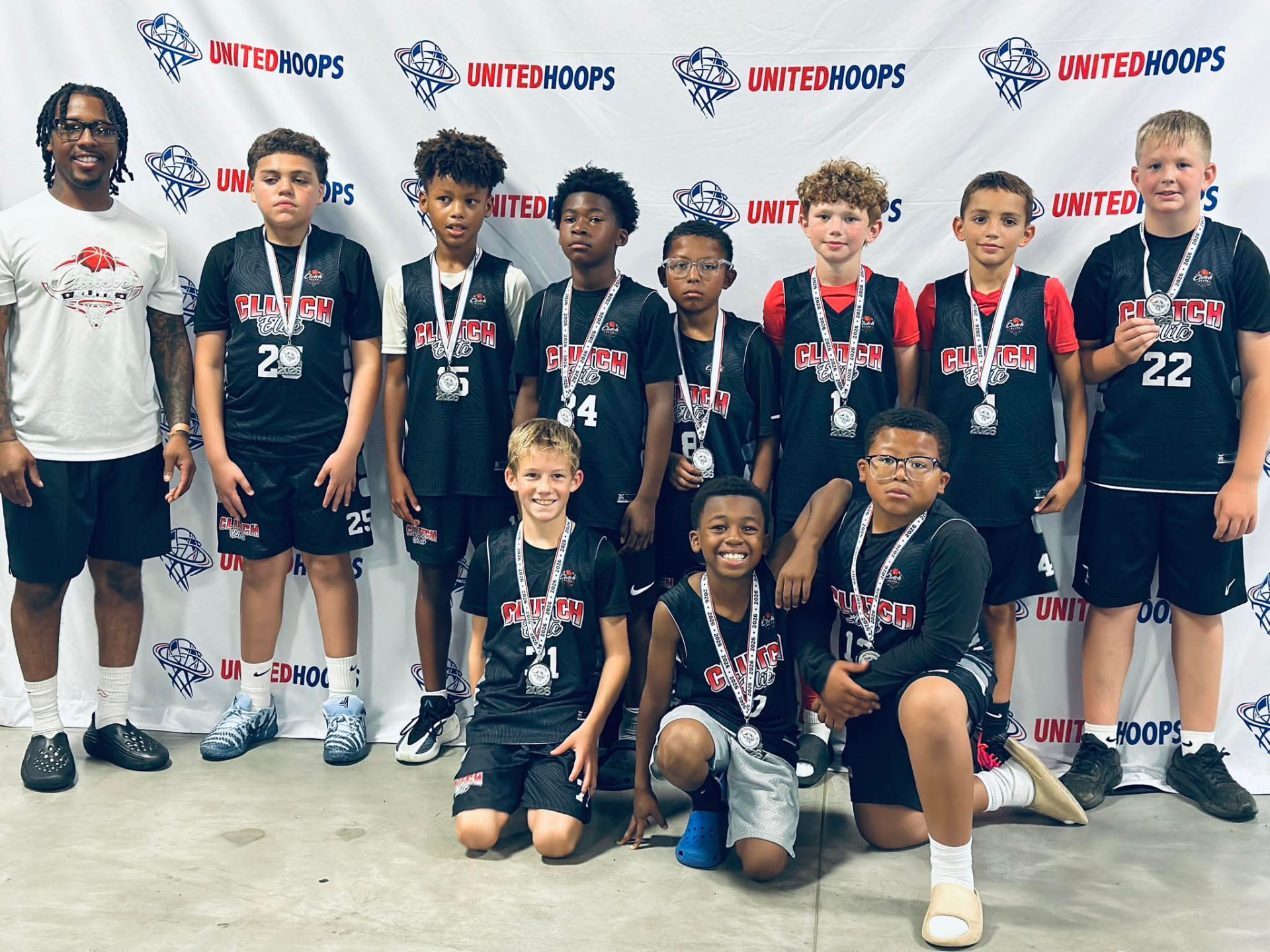 Clutch Elite team with coach after a tournament
